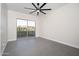 Empty room with sliding glass doors leading to a patio or balcony at 7590 W Firebird Dr, Glendale, AZ 85308