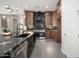 Spacious, modern kitchen with a large center island, stainless steel appliances, and custom wood cabinets at 7590 W Firebird Dr, Glendale, AZ 85308