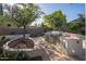 Outdoor kitchen and landscaped backyard, perfect for enjoying outdoor grilling at 7590 W Firebird Dr, Glendale, AZ 85308