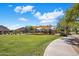 Community park featuring large grassy field, sidewalks, playground, and ramada at 7758 E Nestling Way, Scottsdale, AZ 85255