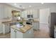 Well-appointed kitchen featuring stainless steel appliances, granite countertops, and a functional island at 7758 E Nestling Way, Scottsdale, AZ 85255