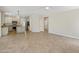 Open-concept living space blending the kitchen and living room, filled with natural light at 7758 E Nestling Way, Scottsdale, AZ 85255