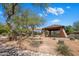 Community playground with shade cover, picnic tables and mature landscaping at 7758 E Nestling Way, Scottsdale, AZ 85255