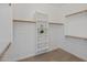 Walk-in closet with shelves and racks for organized storage at 7758 E Nestling Way, Scottsdale, AZ 85255