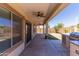 Spacious covered patio with ceiling fans and a built-in grill, perfect for outdoor entertaining at 7925 S 52Nd Dr, Laveen, AZ 85339