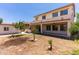 Expansive backyard with patio, lawn, and lush greenery at 7925 S 52Nd Dr, Laveen, AZ 85339