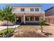 Large backyard featuring a covered patio, barbeque area, and desert landscaping at 7925 S 52Nd Dr, Laveen, AZ 85339