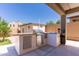 Backyard barbeque featuring stainless steel grill and granite countertops at 7925 S 52Nd Dr, Laveen, AZ 85339