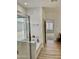 Bright bathroom features a glass-enclosed shower and a bath at 7925 S 52Nd Dr, Laveen, AZ 85339