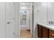Bathroom with wood cabinets, quartz countertops and shower with decorative tile at 7925 S 52Nd Dr, Laveen, AZ 85339