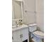 Modern half bath with white vanity, mirror, and fixtures at 7925 S 52Nd Dr, Laveen, AZ 85339