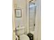 Cozy bathroom with white tile in shower, toilet, and motivational art at 7925 S 52Nd Dr, Laveen, AZ 85339