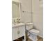 Modern half bath with white vanity, mirror, and fixtures at 7925 S 52Nd Dr, Laveen, AZ 85339