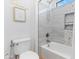 Bathroom featuring decorative wall art and shower with decorative tile surround at 7925 S 52Nd Dr, Laveen, AZ 85339