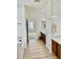 Bright bathroom features a long granite vanity, walk-in shower and a bath at 7925 S 52Nd Dr, Laveen, AZ 85339