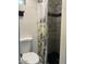 Cozy bathroom shower with custom tiles and flower curtain at 7925 S 52Nd Dr, Laveen, AZ 85339