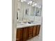 Bathroom with double vanity and bright lighting at 7925 S 52Nd Dr, Laveen, AZ 85339