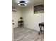 A bedroom showing a modern ceiling fan, side tables, and a desk at 7925 S 52Nd Dr, Laveen, AZ 85339
