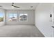 Carpeted bedroom with two windows at 7925 S 52Nd Dr, Laveen, AZ 85339