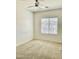 Bright bedroom with neutral carpet, a ceiling fan, and large window at 7925 S 52Nd Dr, Laveen, AZ 85339