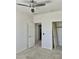 Bright bedroom with neutral carpet, a ceiling fan, and closets at 7925 S 52Nd Dr, Laveen, AZ 85339
