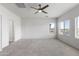 Bright bedroom with carpet and window views at 7925 S 52Nd Dr, Laveen, AZ 85339