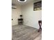 Light bedroom featuring gray tile floors and a mini split AC unit at 7925 S 52Nd Dr, Laveen, AZ 85339