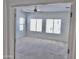 Spacious bedroom with ceiling fan and large windows offering natural light at 7925 S 52Nd Dr, Laveen, AZ 85339