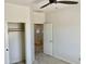 Bedroom featuring an open closet with a ceiling fan at 7925 S 52Nd Dr, Laveen, AZ 85339