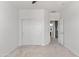 Light bedroom with carpet, closet, and an en-suite bathroom at 7925 S 52Nd Dr, Laveen, AZ 85339