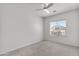 Bright bedroom with ceiling fan and a window for natural light at 7925 S 52Nd Dr, Laveen, AZ 85339