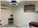 Cozy bedroom featuring an air conditioner and decorative wall art, offering comfort at 7925 S 52Nd Dr, Laveen, AZ 85339