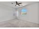Spacious bedroom with a unique window shape at 7925 S 52Nd Dr, Laveen, AZ 85339