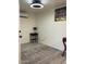 Neutral bedroom with tile floors, mini split AC unit and decor accents at 7925 S 52Nd Dr, Laveen, AZ 85339