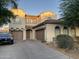 Charming two-story home boasts a three-car garage and well-maintained front yard at 7925 S 52Nd Dr, Laveen, AZ 85339