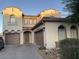 Stunning two-story home featuring a tile roof, multiple garages and a neutral colored stucco exterior at 7925 S 52Nd Dr, Laveen, AZ 85339