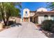 Stunning home with a spacious driveway, two-car garage, and meticulous landscaping, highlighting the property's charm and appeal at 7925 S 52Nd Dr, Laveen, AZ 85339