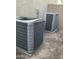 Outside view of two gray HVAC units, essential for climate control at 7925 S 52Nd Dr, Laveen, AZ 85339