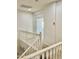 Bright hallway with white trim and neutral carpet leads to bedrooms at 7925 S 52Nd Dr, Laveen, AZ 85339