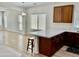 Open concept kitchen with seating area, quartz countertops, and modern cabinets at 7925 S 52Nd Dr, Laveen, AZ 85339
