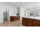 Spacious kitchen with hardwood floors and plentiful cabinet storage space at 7925 S 52Nd Dr, Laveen, AZ 85339