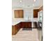 Well-lit kitchen with wood cabinets, stainless appliances, and light-colored countertops at 7925 S 52Nd Dr, Laveen, AZ 85339