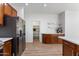 Spacious kitchen with stainless steel appliances, hardwood floors, and large pantry at 7925 S 52Nd Dr, Laveen, AZ 85339