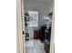 This laundry room features a modern washer and dryer, and ample shelving and a window that allows natural light at 7925 S 52Nd Dr, Laveen, AZ 85339