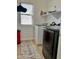 Bright laundry room featuring modern washer and dryer at 7925 S 52Nd Dr, Laveen, AZ 85339