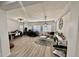 Spacious living room with light colored flooring and a neutral palette featuring a home office at 7925 S 52Nd Dr, Laveen, AZ 85339