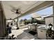 Covered outdoor kitchen features a built-in BBQ, sink, and ample counter space, ideal for entertaining at 7925 S 52Nd Dr, Laveen, AZ 85339