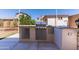 Well-equipped outdoor kitchen with stainless steel grill and built-in countertop space at 7925 S 52Nd Dr, Laveen, AZ 85339