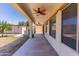 Covered patio with ceiling fans and outdoor living space at 7925 S 52Nd Dr, Laveen, AZ 85339