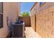 Narrow side yard with HVAC unit and block wall fencing at 7925 S 52Nd Dr, Laveen, AZ 85339